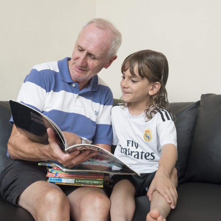 Volunteer reading with child