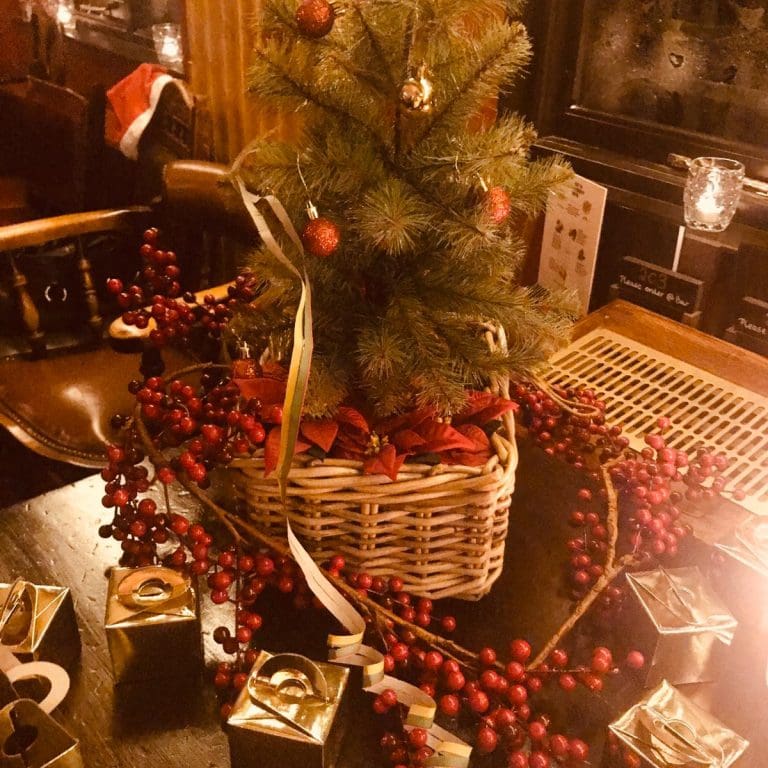 Small Christmas trees with small presents around it