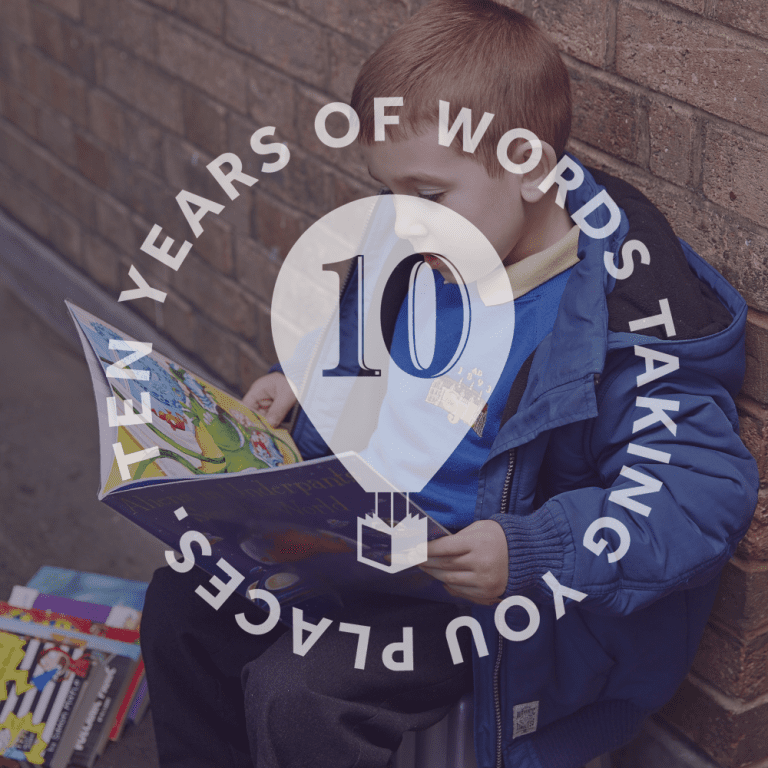 Little boy reading with 10 Years Of Words Taking You Places written over top