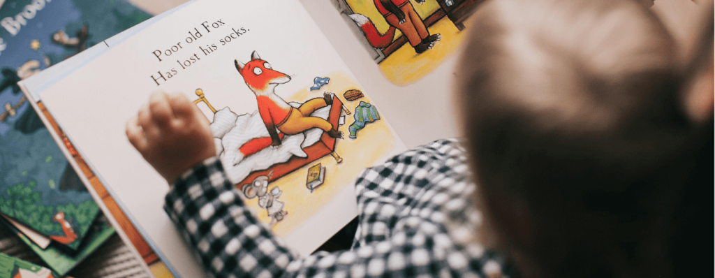 Small child reading book