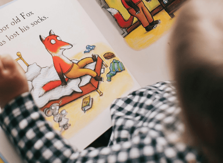 Small child reading book